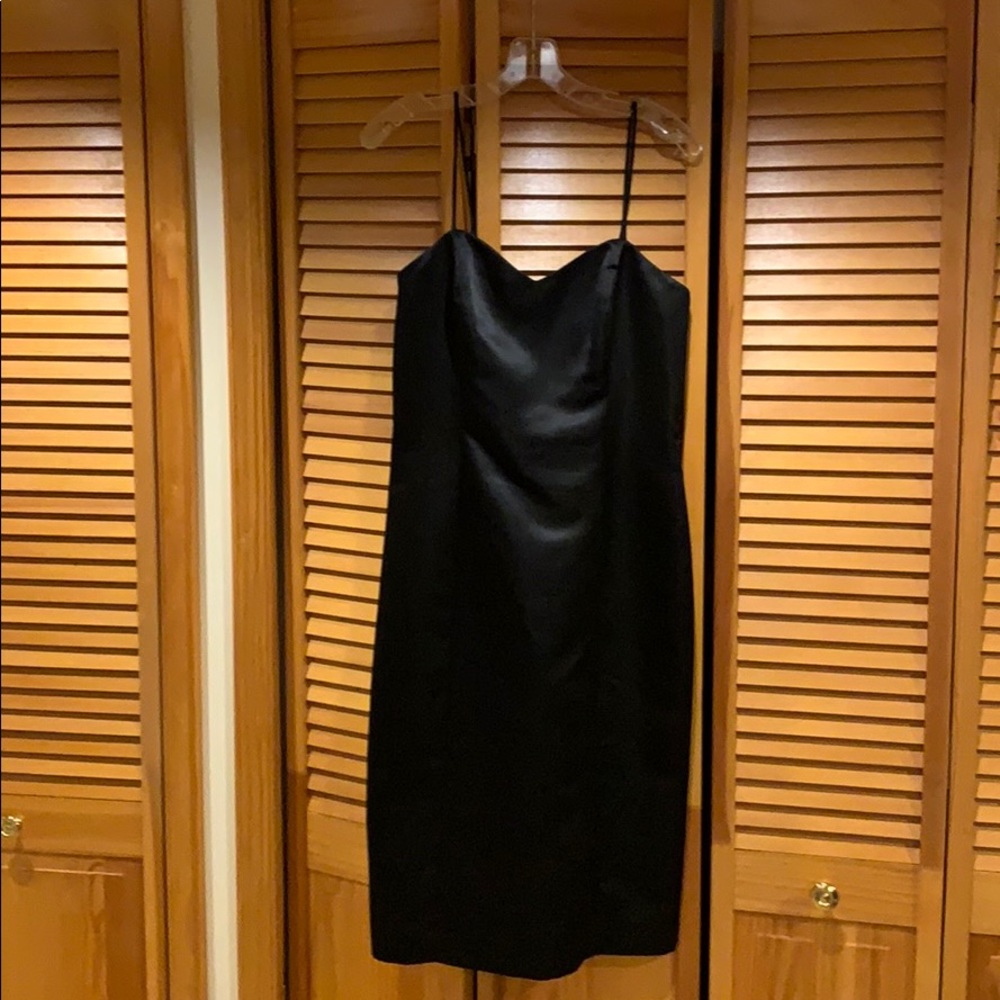 Black semi formal dress. Falls right below knee.